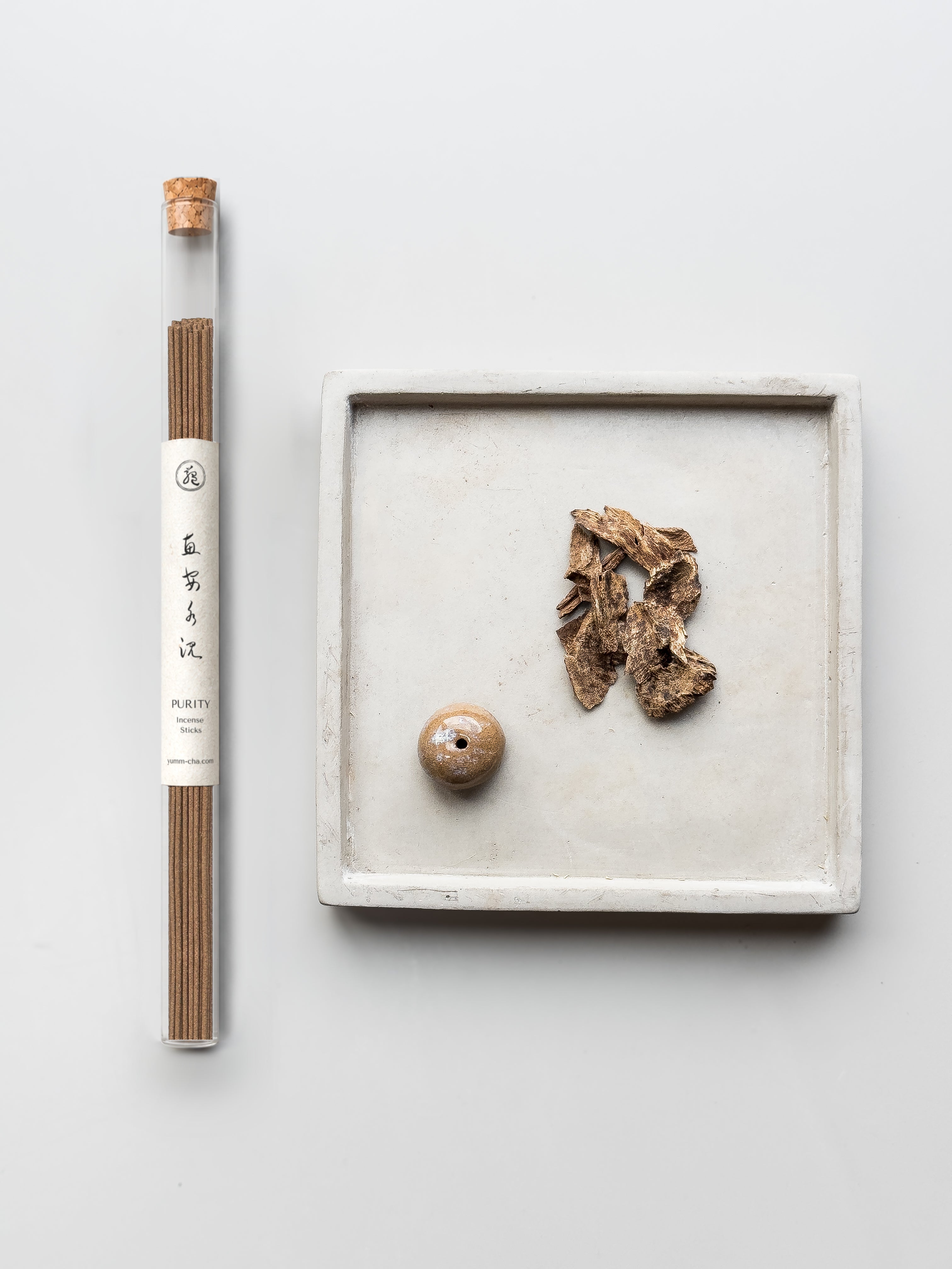 PURITY incense sticks in a cork-stoppered glass tube